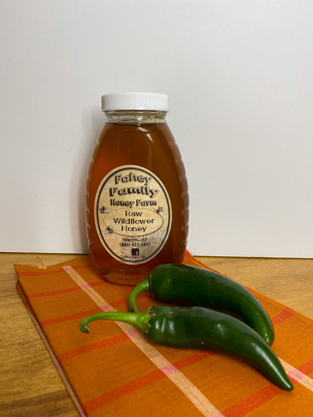 Bottle of honey and hot peppers